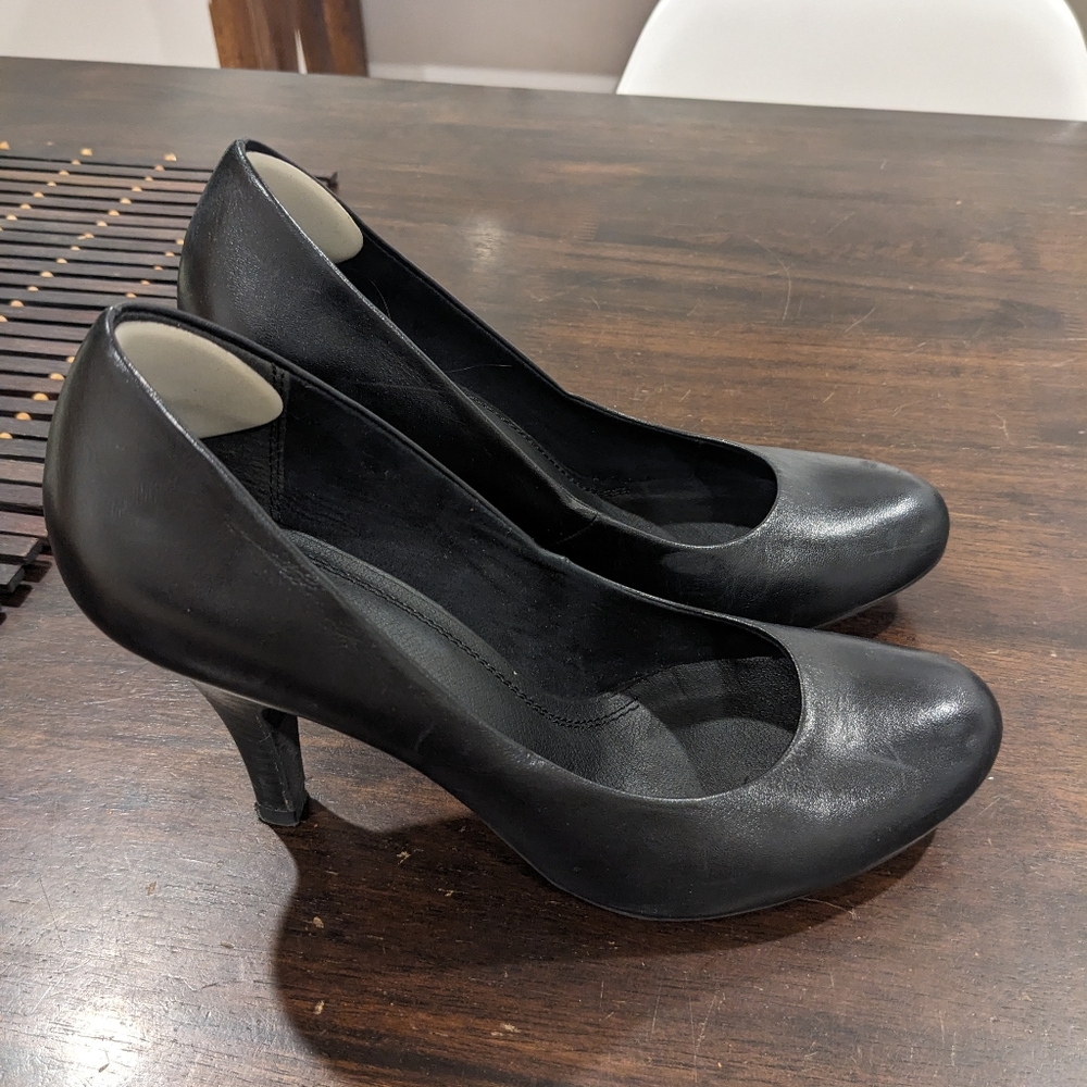 Black round toe high heeled shoes from Aldo.